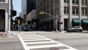 Pedestrian crossing in busy Los Angeles intersection